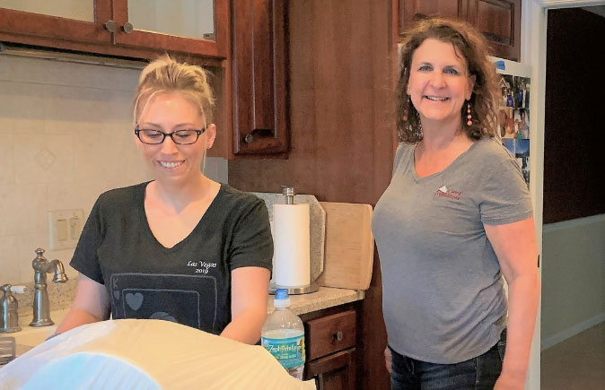 Caring Transitions associate helping clean out an apartment